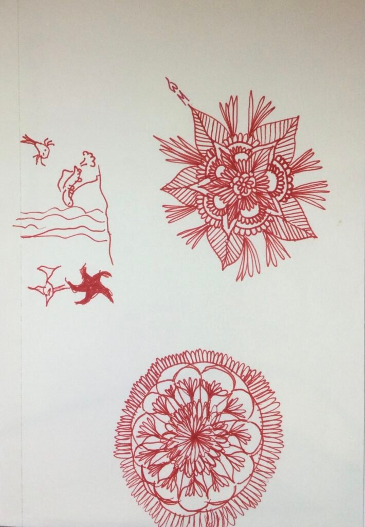 2 red flowers and small sea